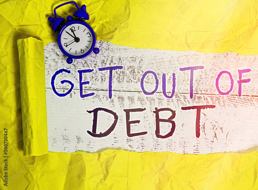 Handwriting text Get Out Of Debt. Conceptual photo changing spending habit Learn to budget Prioritizing debts