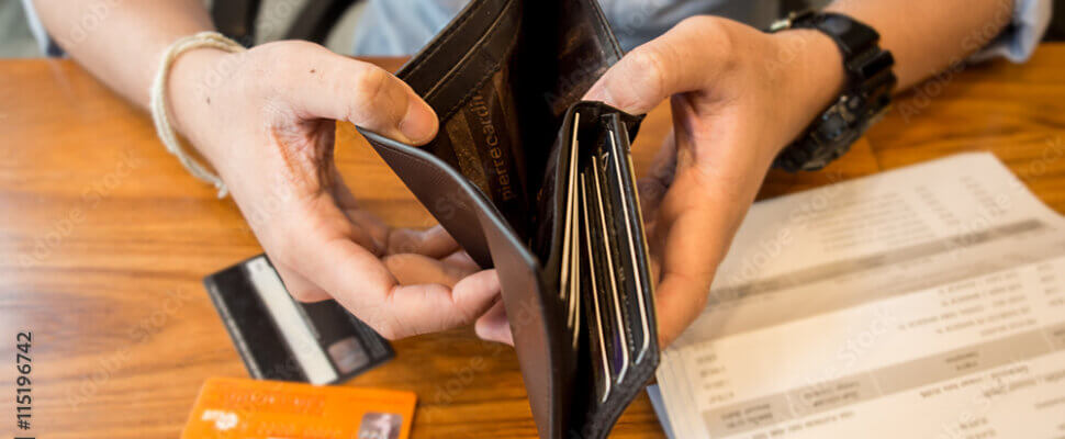 credit card debt - holding an empty wallet.